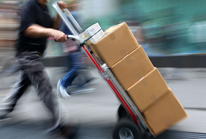 A courier delivering parcels